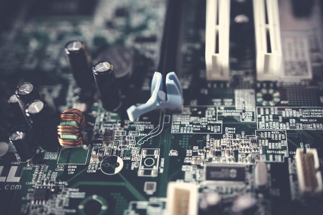 about-us-02 Detailed view of components on a computer motherboard, showcasing technology and circuitry.
